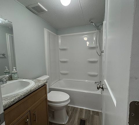 Guest bathroom. New shower, toilet, and vanity. 34" vanity.