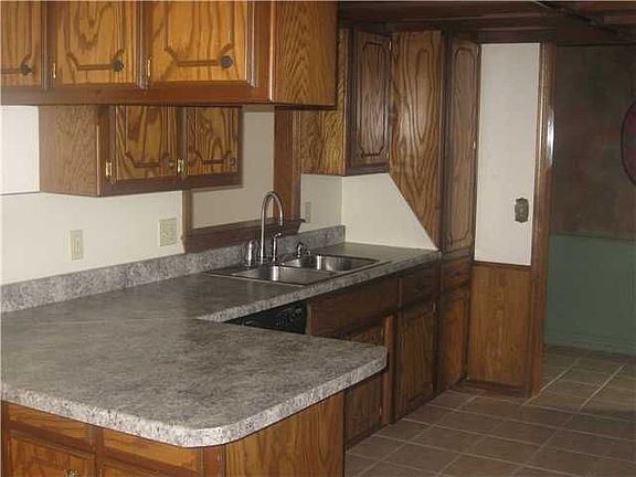 Sink side of kitchen that over looks the living room.