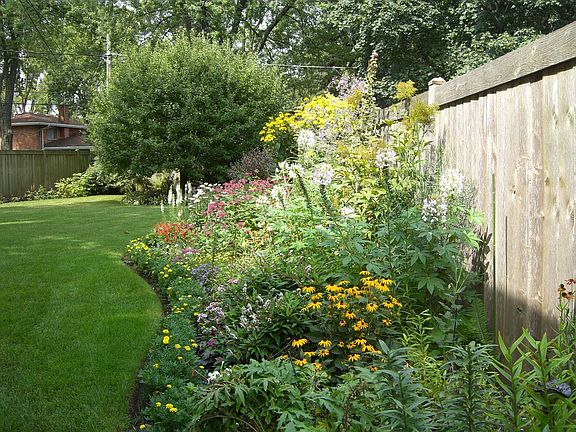 perennial garden and fenced yard