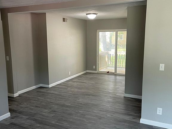 Open dining room with sliding door to patio
