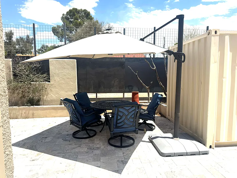 Included patio table, chairs and large umbrella