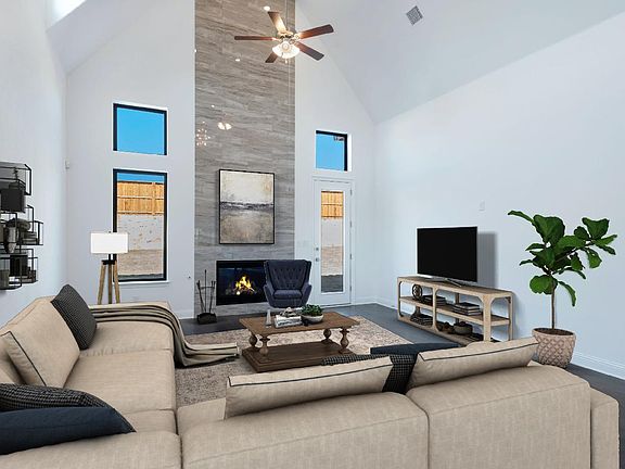 Floor to ceiling tiled fireplace in great room, virtually staged for demonstration