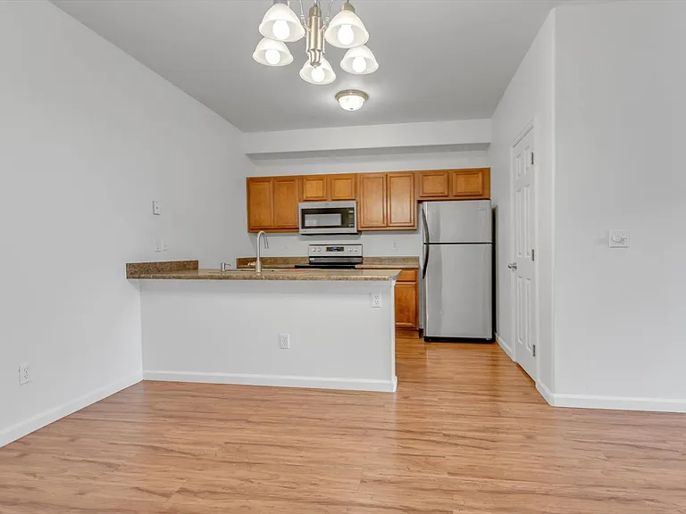 Kitchen with pantry and stainless steel appliances