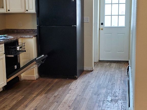 Kitchen leading to basement and back door.