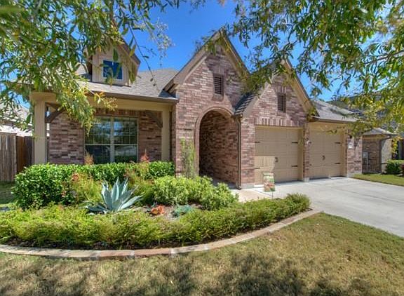 Exterior front with beautiful landscaping