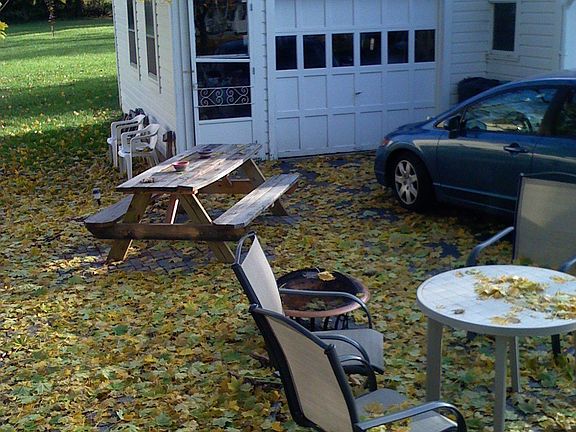 Patio covered with leaves, Fall 07, One half of garage.