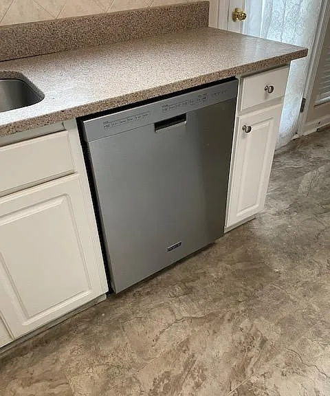 Dishwasher + Quartz countertops + recent faucets in sink and throughout the house