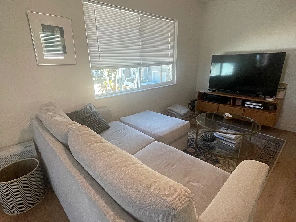 Living room, large picture window with blinds.