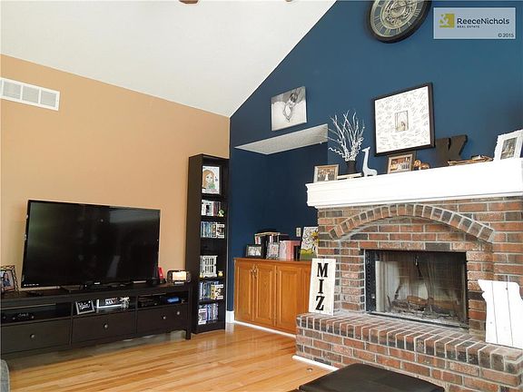 Fireplace with gas start and built ins.