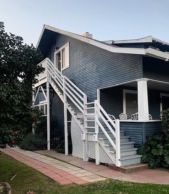 Exterior view, stairs leading to second story apartment