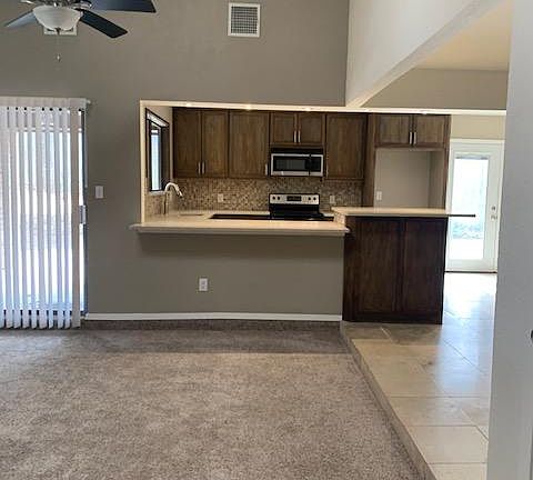 Open-concept living room looking into kitchen