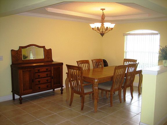 Formal dining room with trayed ceiling