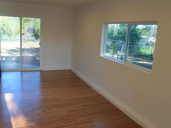 living room/dining area w/sliding glass door to backyard