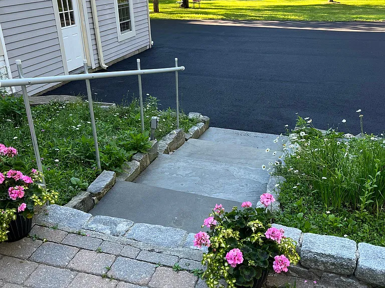 Newly paved driveway, Resident entrance off driveway.