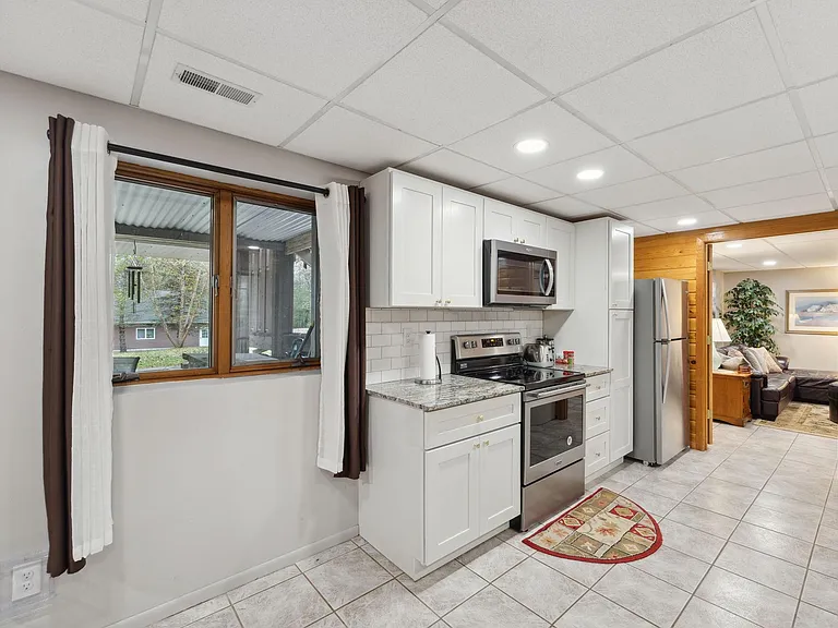 Granite countertop and stainless steel applicances.