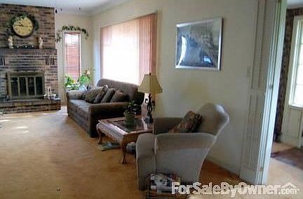 comfortable living room
						:
						has nice brick fireplace with venting does a great job of heating...