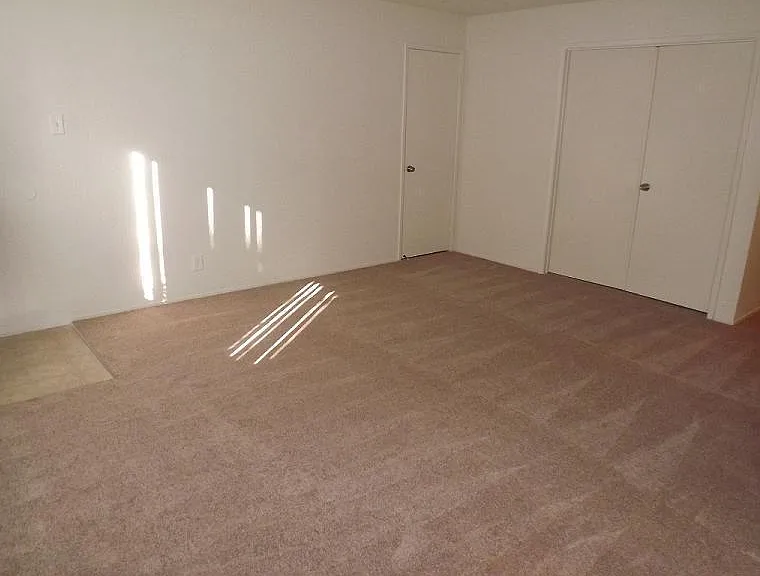 Bedroom with carpet