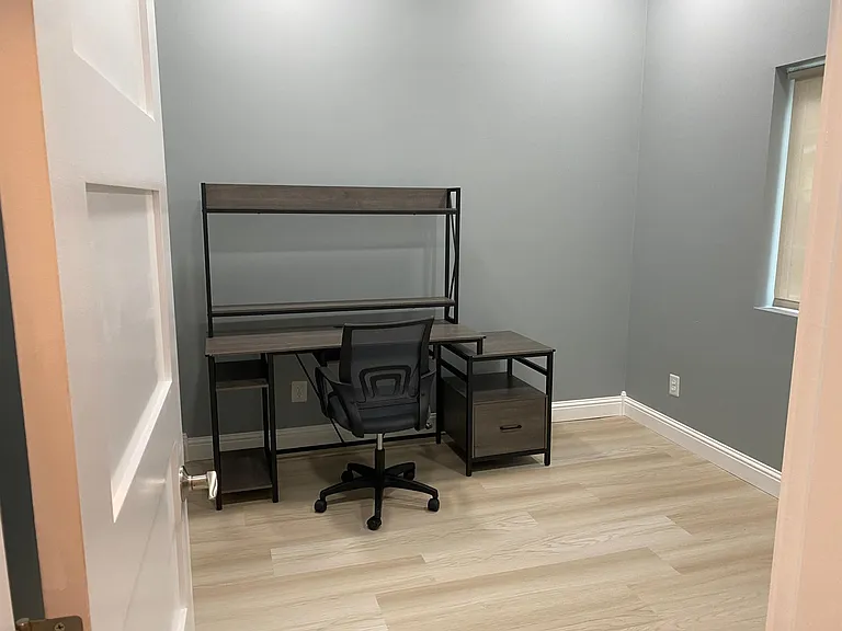 Spacious office with new desk.