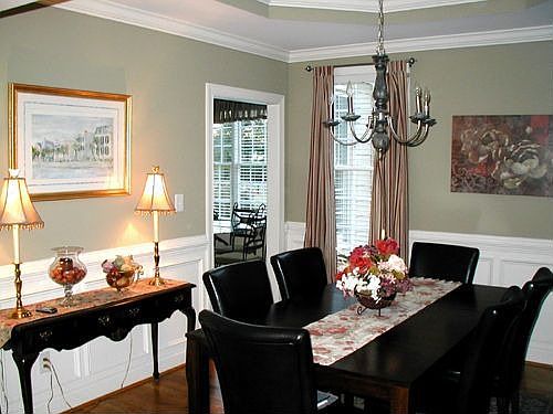 Formal Dining Room has trey ceiling,wainscot, chair rail and crown molding
