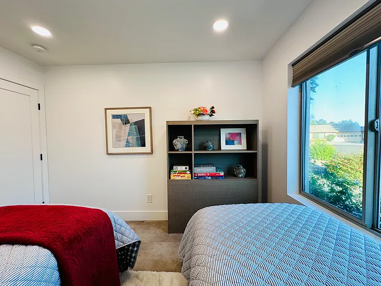 Guest Bedroom 3: 
Two Twin beds, ideal for kids, singles, or friends traveling together.