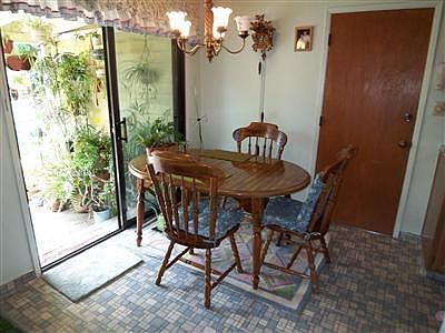 Breakfast nook has view of Beautiful Lush Yard. 