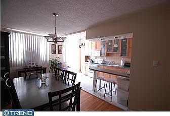 Warm and inviting dining room with beautiful hardwood floors.