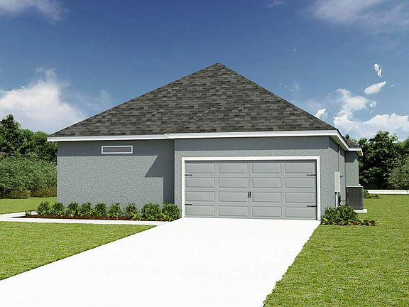An attached 2-car garage is located at the rear of the home.