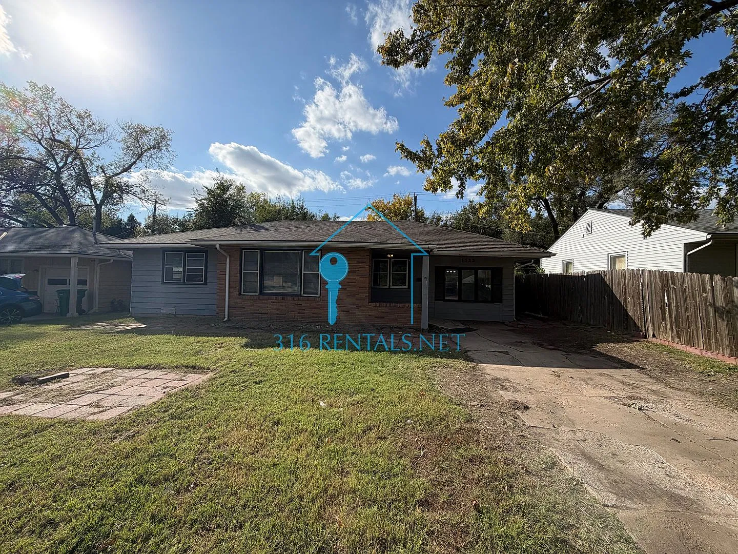 $1,245 | 4 Bed Wichita Home | Hardwood Floors, Fenced Yard & Deck | Pets OK — Photo 1