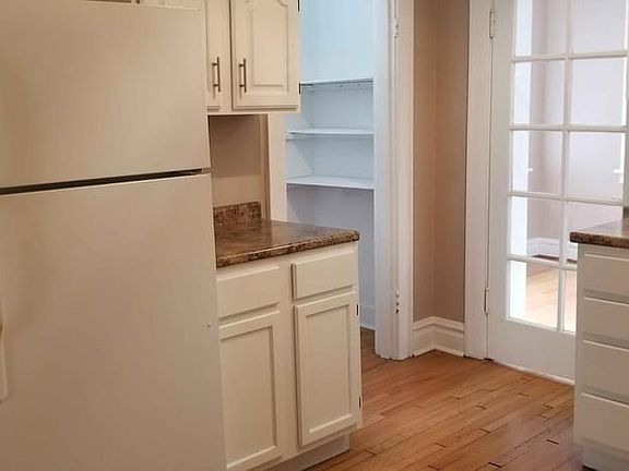 kitchen, pantry, sunroom behind glass door