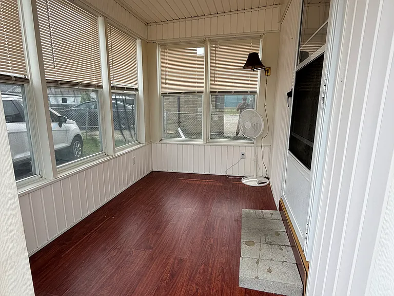 Back entrance. Sun room/mud room.