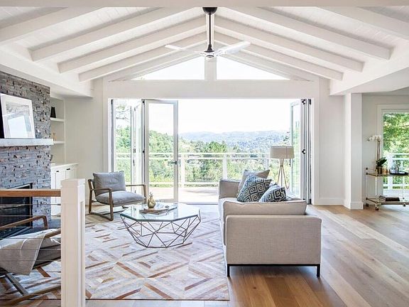 Cantina doors, ceiling blue tooth fan and temperature controlled gas fireplace. Views for days. Light & bright.