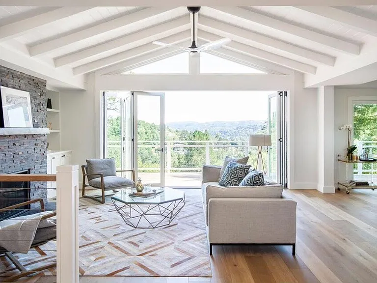 Cantina doors, ceiling blue tooth fan and temperature controlled gas fireplace. Views for days. Light & bright.