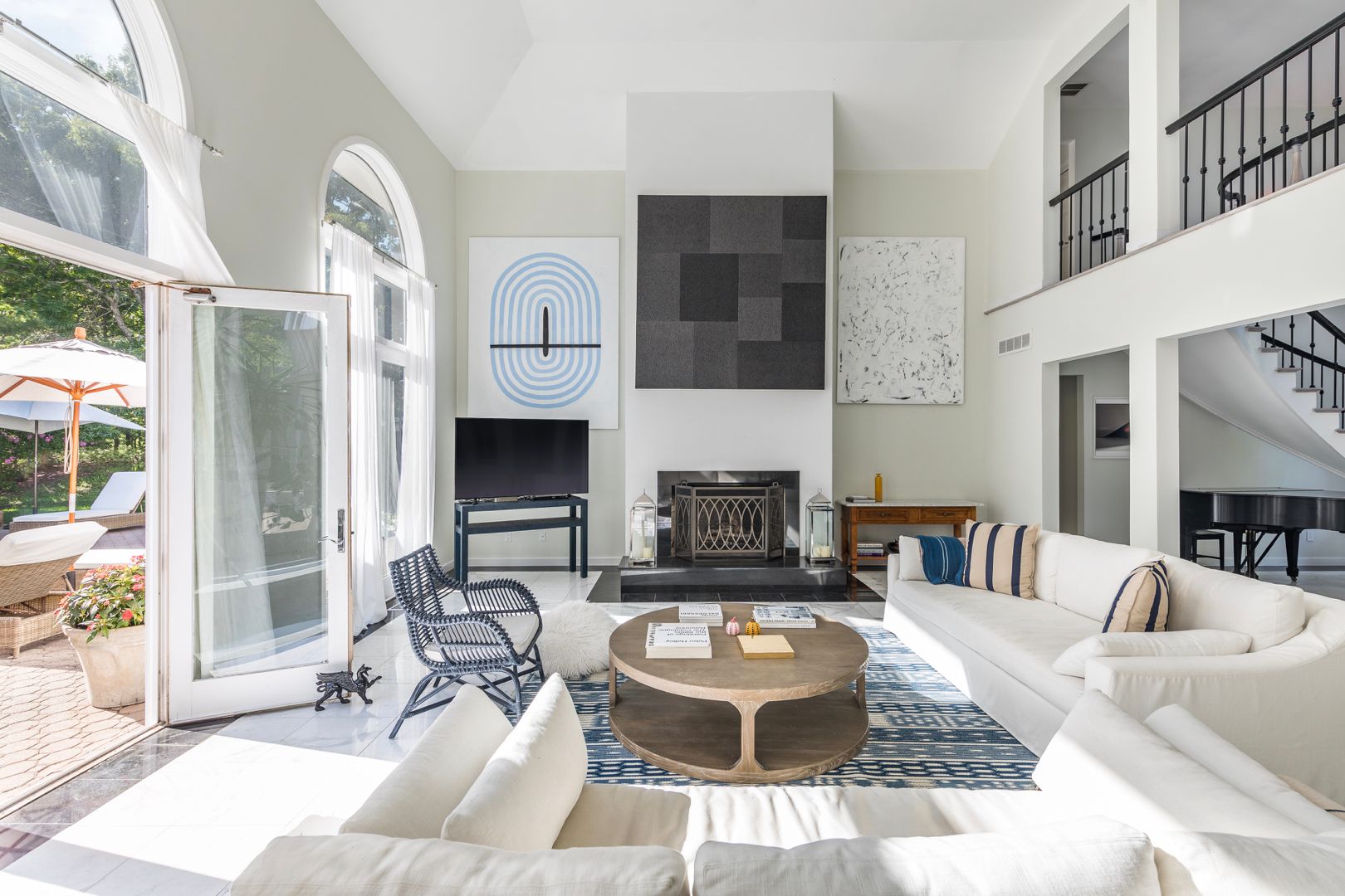  Living Room, outfitted with Restoration Hardware lounge furniture. Direct access to pool area.