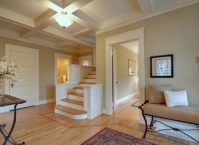 Gracious formal entry displays beamed ceilings.Gleaming hardwood floors flow throughout main and sec