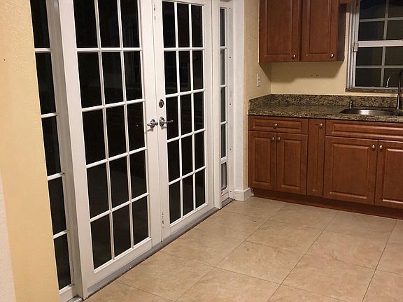 FRENCH DOOR LEADING TO LARGE YARD