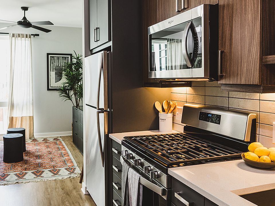 Chef-inspired galley kitchens with gas cooking, quartz counters and tile backsplash