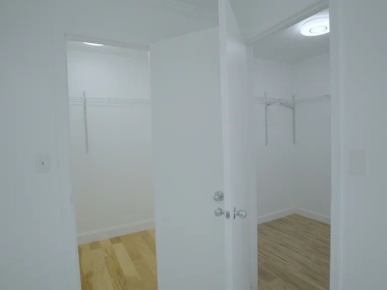 His & Hers closets side by side in Master suite
