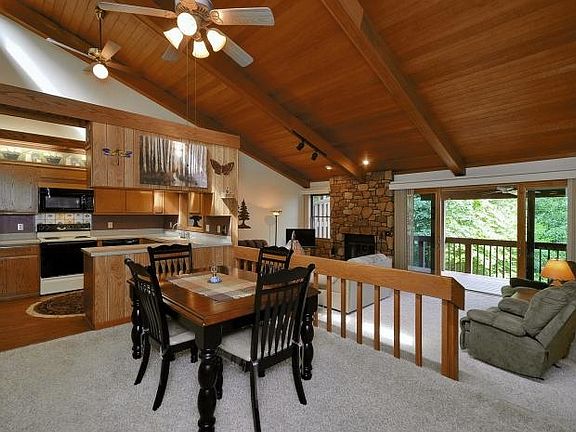 Open 1st Floor : High vaulted ceilings, new insulated windows & Anderson slider, stone fireplace.