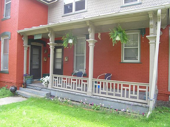 The door on the left is the entryway to the apartment. This porch actually belongs to your neighbor who lives behind the door on the right.