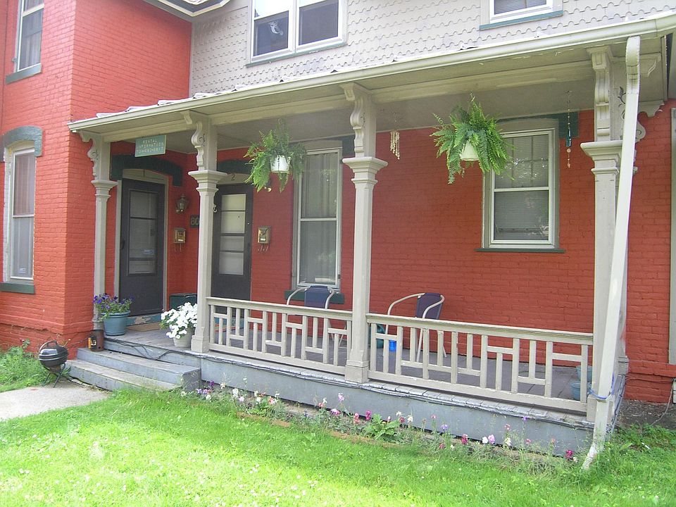 The door on the left is the entryway to the apartment. This porch actually belongs to your neighbor who lives behind the door on the right.