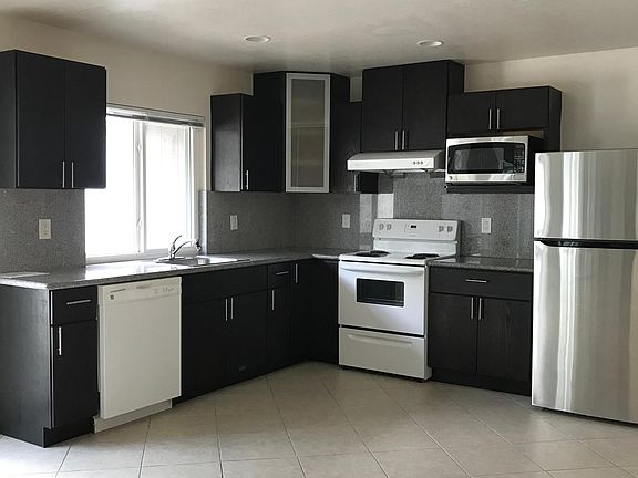Kitchen with recess lights and tile floor
