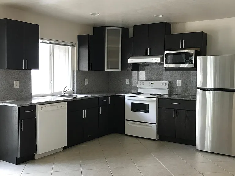 Kitchen with recess lights and tile floor