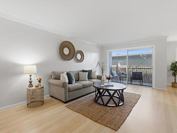 Living area and balcony in background.