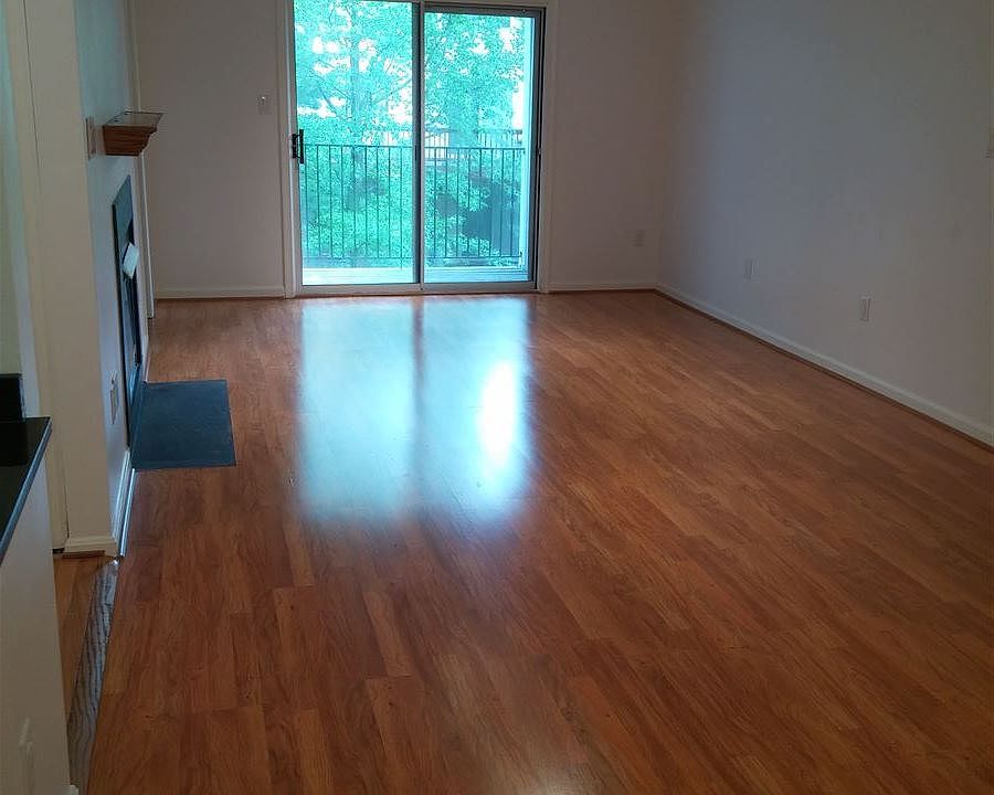 Bright large living area with dining and fireplace