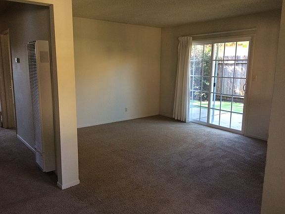 Living room view and peek of exterior private gated yard