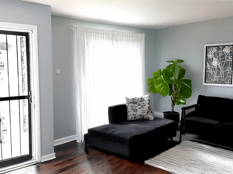 Main floor living room with large window (furniture not included).