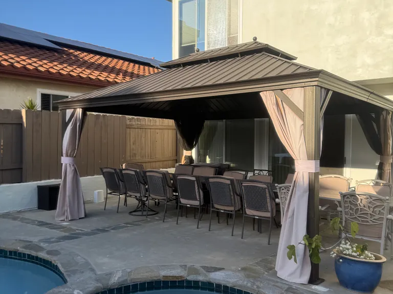 Gazebo with dining over-looking the pool and spa