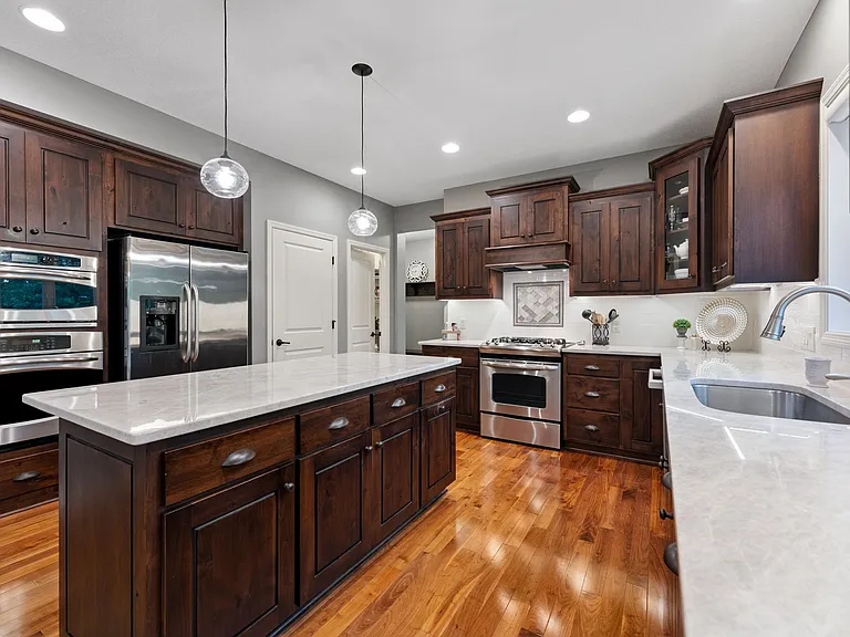 Door to basement & walk-in pantry to right of fridge