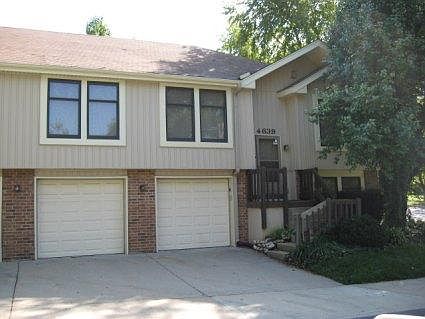 Exterior from across the street - garage doors just replaced 11/2022