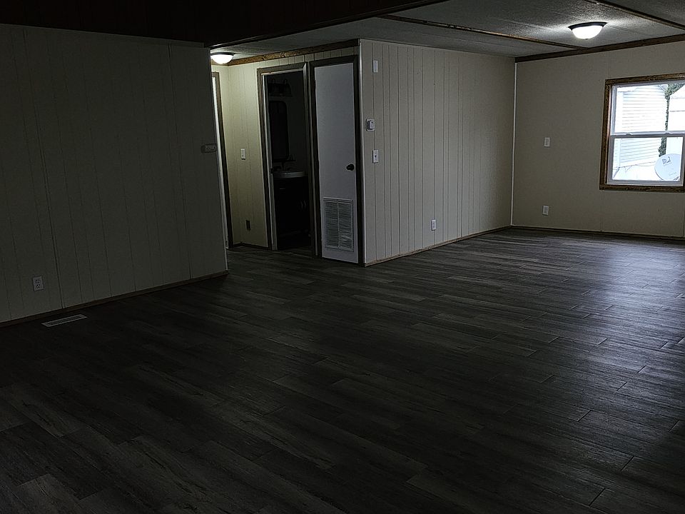 Living room and dining area. Photo from entry door.